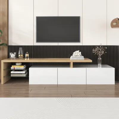 A modern living room setup with a TV mounted on the wall above a white and wood-tone TV stand.