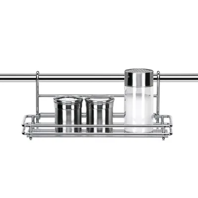 A spice rack with salt and pepper shakers hanging from a rail.