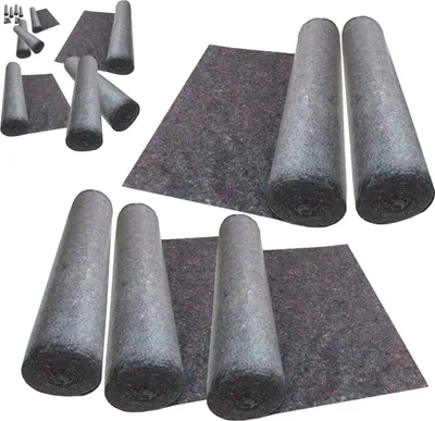 Several rolls of grey protective felt material are laid out on a white background, some unrolled to show the material.