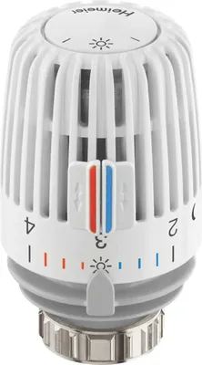 A close-up studio shot of a white Heimeier thermostat head.