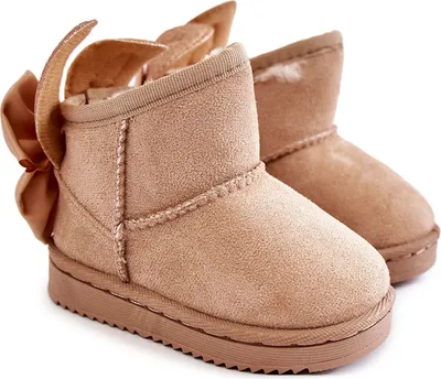 A pair of beige snow boots with bows on a white background.