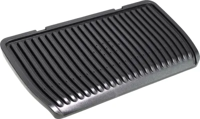A black grill plate with raised ridges and small holes.