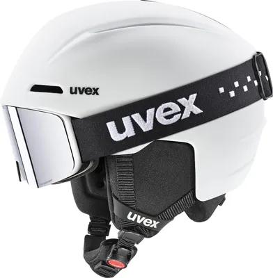 A white ski helmet with a black goggle strap and integrated goggles.