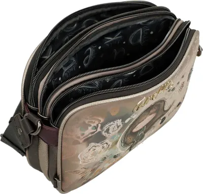 An open handbag with multiple compartments.