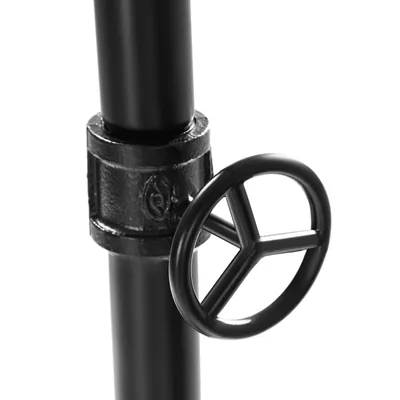Close-up of a black pipe fitting with a decorative wheel.