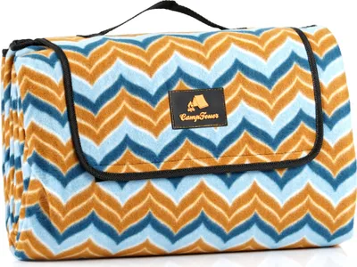 A folded picnic blanket with a zigzag pattern.