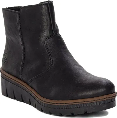 A black leather ankle boot with a wedge sole.