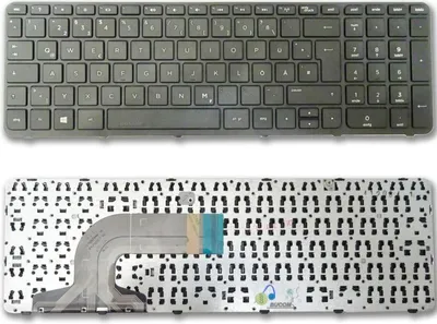 A top-down view of a laptop keyboard and its disassembled components.