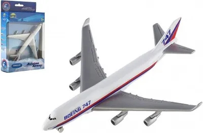 A toy Boeing 747 airplane is shown, with its packaging in the background.