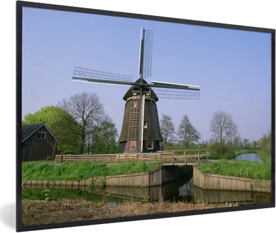 Produktbild von MuchoWow® Gerahmtes Poster Windmühle entlang des Kanals 90x60 cm - Poster mit Schwarzem Bilderrahmen Wandposter Rahmen Foto Bilder - Fotorahmen - Foto-Plakat