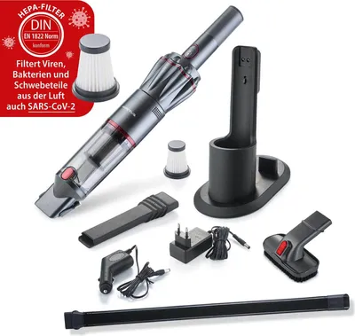 A collection of vacuum cleaner parts and accessories are laid out on a white background.