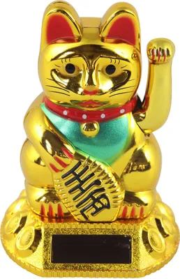 A golden lucky cat figurine with its paw raised, sitting on a decorative base.