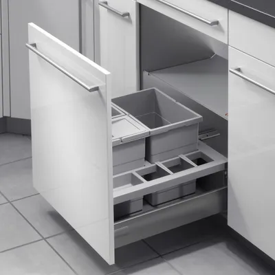 A pull-out kitchen waste sorting system with multiple compartments, shown inside a cabinet.