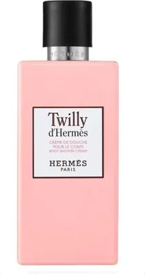 A product shot of a pink bottle of Hermès Twilly d'Hermès body shower cream with a black cap.