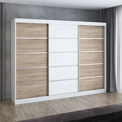 A modern sliding door wardrobe with a white frame and wood-effect panels.
