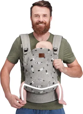 A man is wearing a baby carrier with a baby inside.