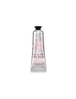 A hand cream tube with a floral design.