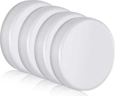 A stack of five white, circular lids, possibly for jars or containers.