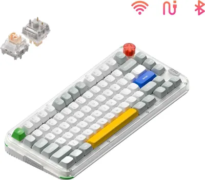 A close-up, angled view of a white and gray mechanical keyboard with colorful accent keys and a red rotary knob. Two keyboard switches are shown in the upper left corner.