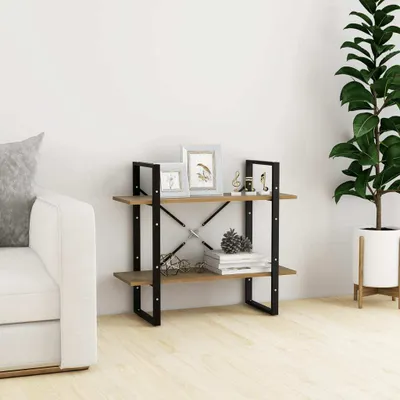 A bookshelf with decorative items next to a sofa and a plant.