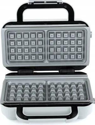 An open waffle maker with its cooking plates visible.