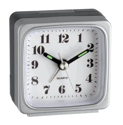 A square analog alarm clock with a silver frame and a white face.