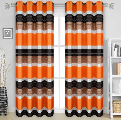 Two curtains with a striped pattern are hanging in front of a window.