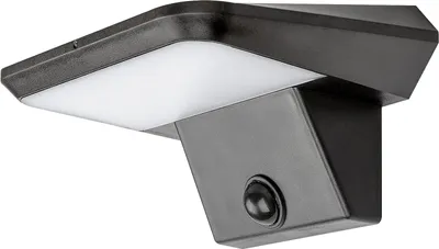A close-up, studio shot of a black and white solar-powered outdoor light fixture with a motion sensor.