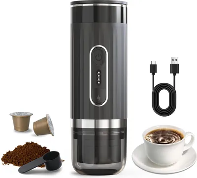 A portable electric espresso machine with accessories and a cup of coffee, presented on a white background.