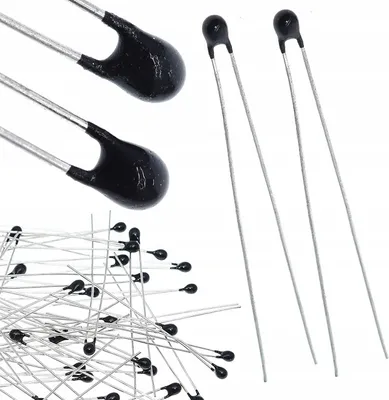 A collection of NTC thermistors on a white background.