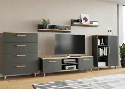 A modern living room setup with a TV, media console, chest of drawers, and shelving unit.