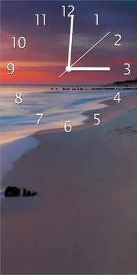 Produktbild von Wallario Design Wanduhr bedruckt, Größe 30 x 60 cm, Motiv: Farbenspiel im Himmel - Sonnenuntergang am Strand