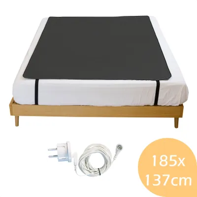 A bed frame with a dark gray mat and bedding, shown with an electrical cord and plug, and a circular graphic with dimensions.