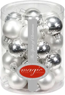 A clear plastic container filled with silver and white Christmas ornaments.