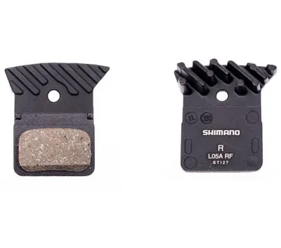 Two bicycle brake pads are shown against a white background.