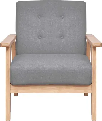 A studio shot of a gray fabric armchair with light wood frame.
