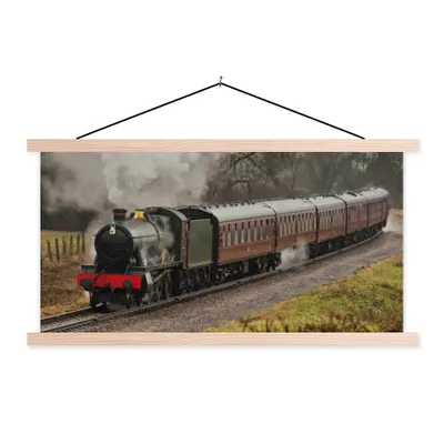 Produktbild von MuchoWow® Textilposter Ein Dampfzug bei grauem Himmel 120x60 cm mit holzfarbenen Rahmen - Klemmleiste