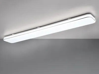 A white LED ceiling light fixture mounted on a white ceiling, with a gray background below.