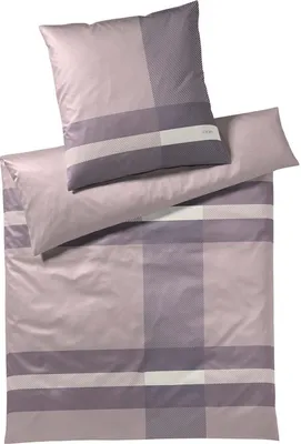 A set of bedding, including a pillowcase and a duvet cover, laid out flat against a white background.