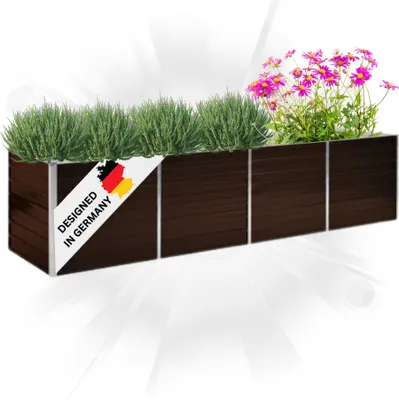 A long, rectangular planter box filled with green plants and pink flowers, with a label indicating it's designed in Germany.