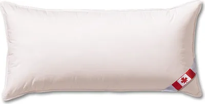A white pillow with a Canadian flag tag on the right side.