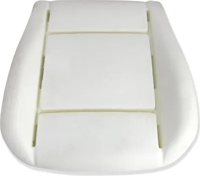 A white foam seat cushion for a car.