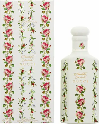A bottle of Gucci Moonlight Serenade Eau de Parfum and its packaging, both decorated with a floral pattern.