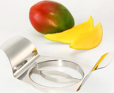 A mango and a mango slicer on a white background.