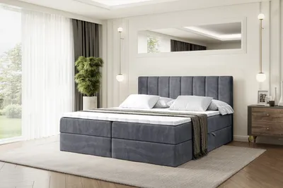 A bedroom scene with a bed, curtains, and a plant.