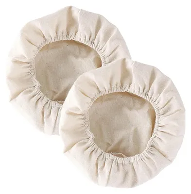 Two beige fabric covers for proofing baskets or bowls, shown against a white background.