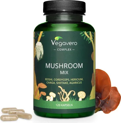 A bottle of Vegavero Mushroom Mix supplements is shown with some loose capsules and a mushroom in the foreground.