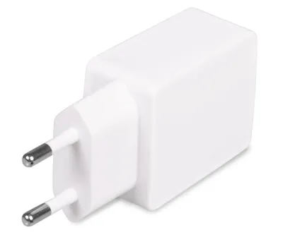 A white USB charger adapter with two prongs for a European outlet.