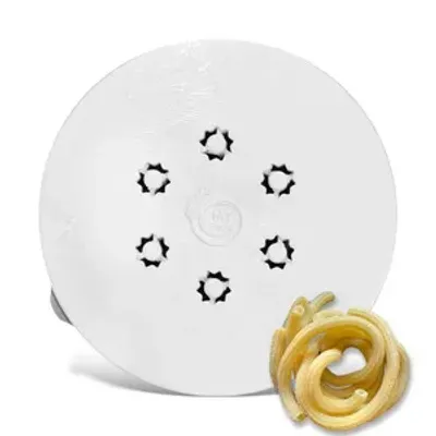 A white pasta maker disc with star-shaped holes and a pile of cooked pasta.