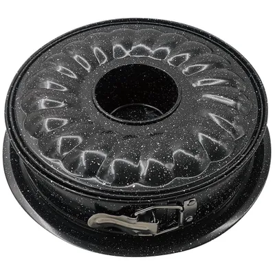 A bundt cake pan with a speckled black and white finish.